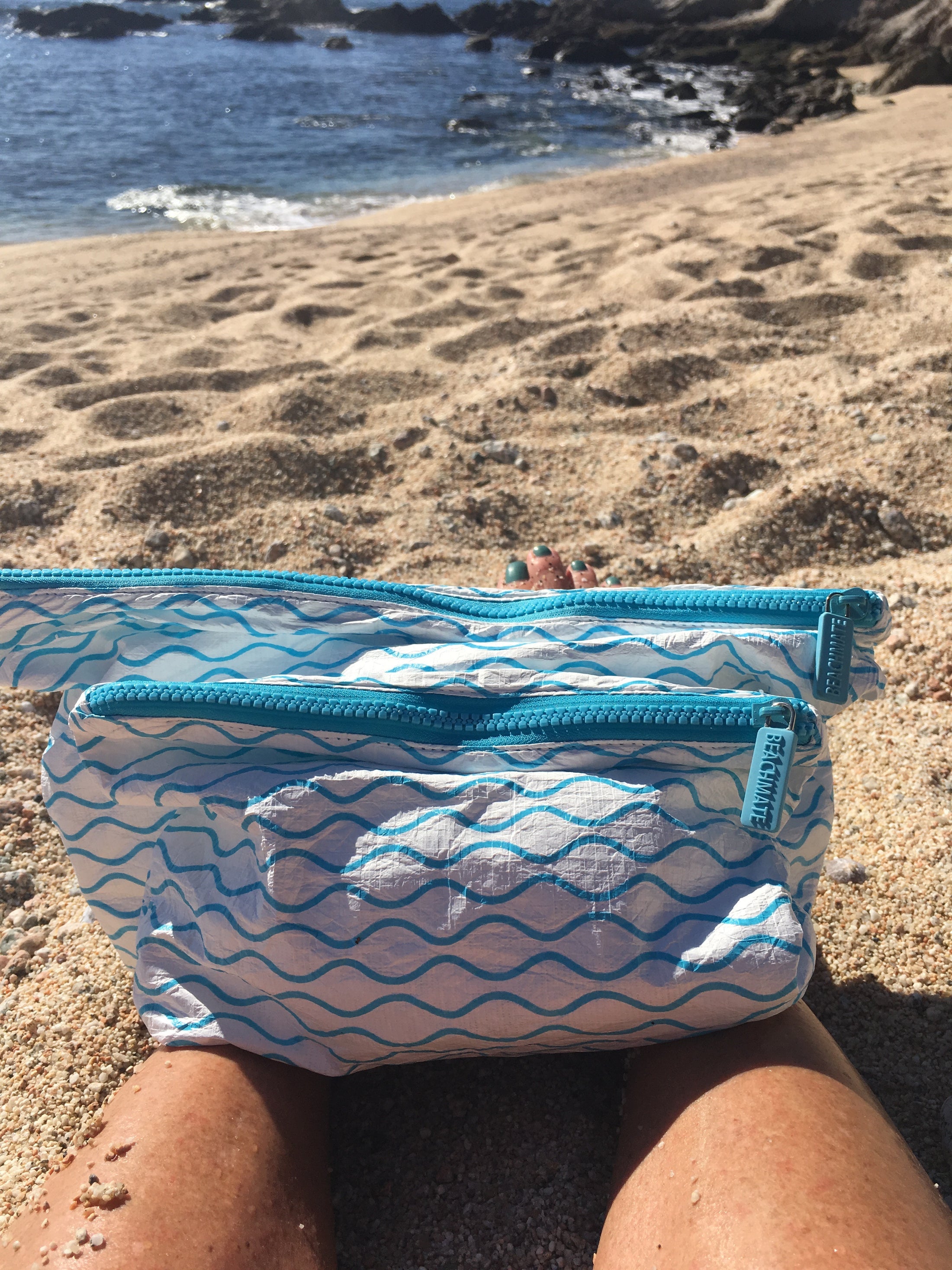 Medium Beachmate accessory pouch held at the beach