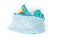 Load image into Gallery viewer, A small white accessory pouch with blue wave patterns, rolled up and containing various small items like a phone and sunnies, against a white background.