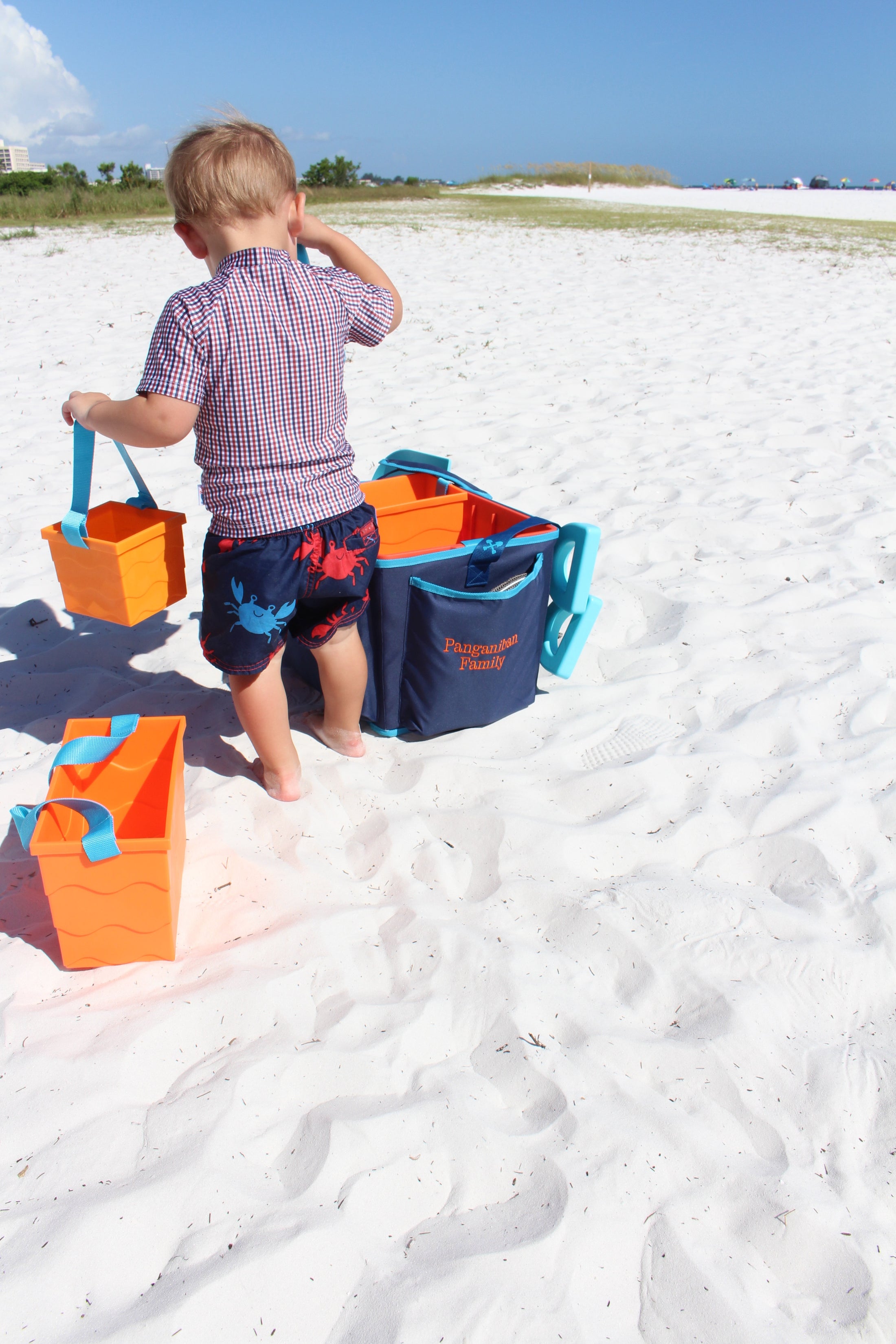 Kids carrying the Beachmate System for a hands‑free trip to the beach