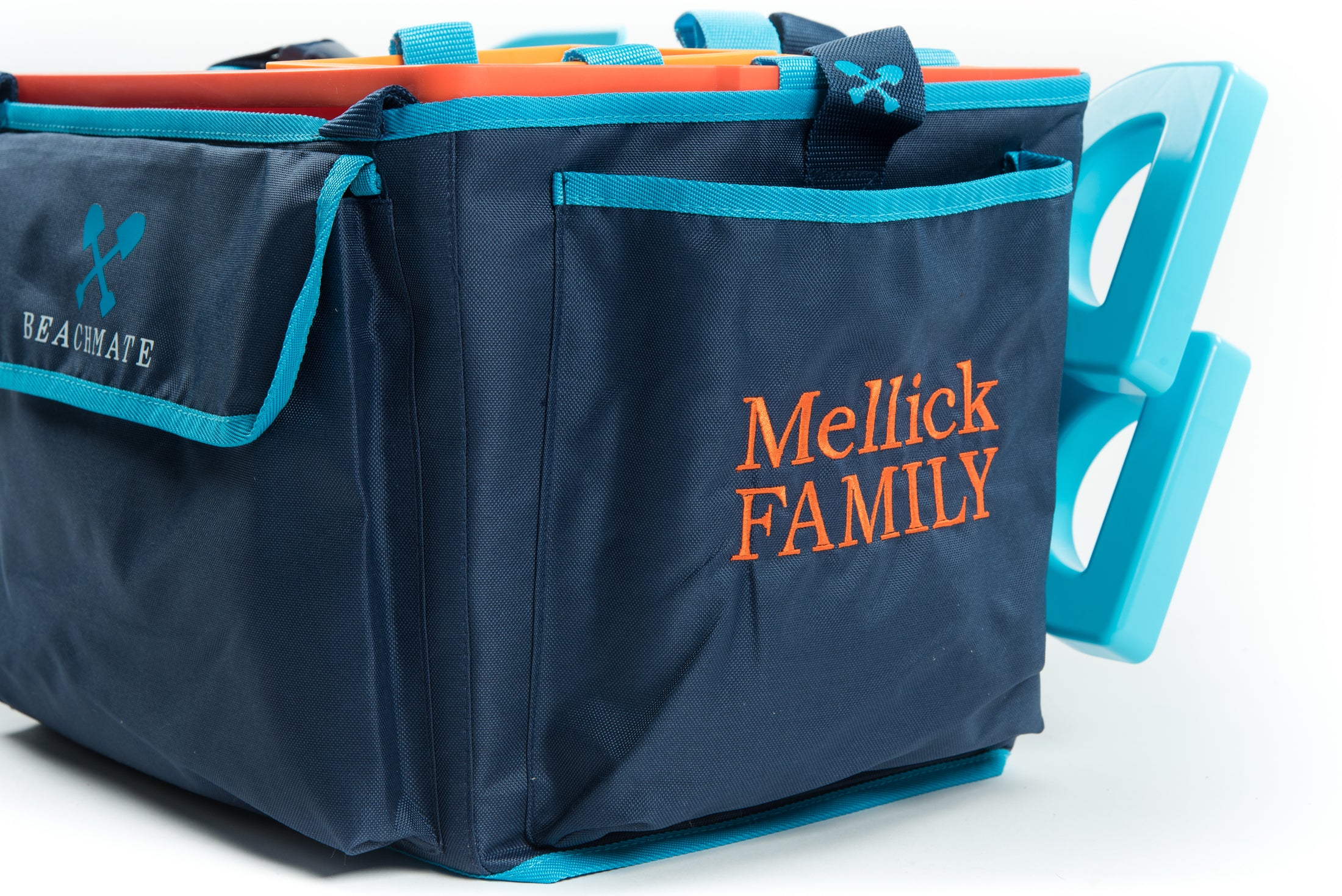 Close‑up of Beachmate System tote showing organized exterior pockets and custom name