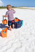 Load image into Gallery viewer, Kids carrying the Beachmate System for a hands‑free trip to the beach
