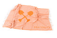 Load image into Gallery viewer, An orange Turkish towel with hand-tied fringe and the text 'BEACHMATE' displayed on it.
