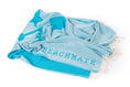 Load image into Gallery viewer, Turquoise Turkish towel by Beachmate laid flat with tassel fringe on white background
